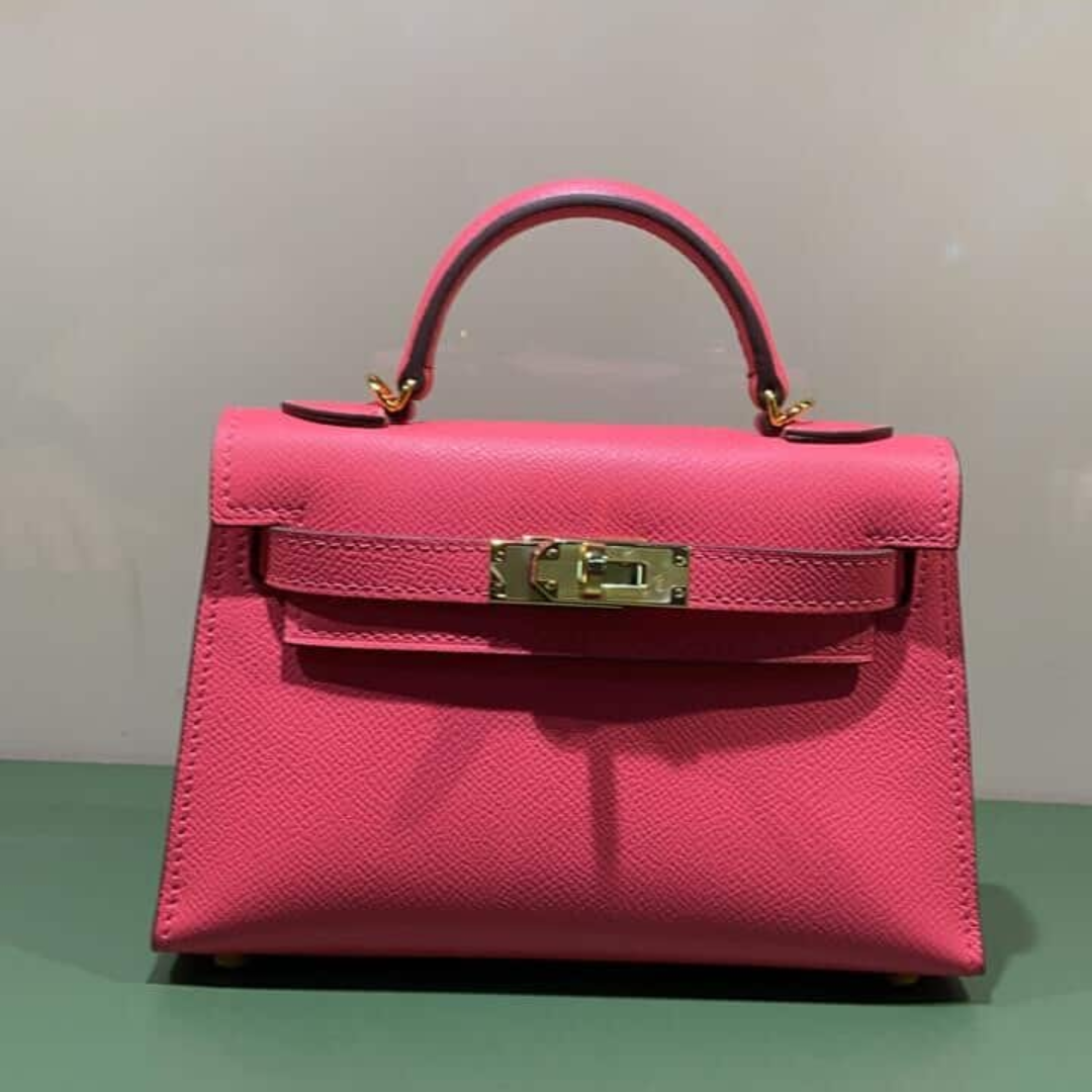 HERMÈS KELLY 20 TASCHE MIT GOLDENEN BESCHLÄGEN IN ROSA